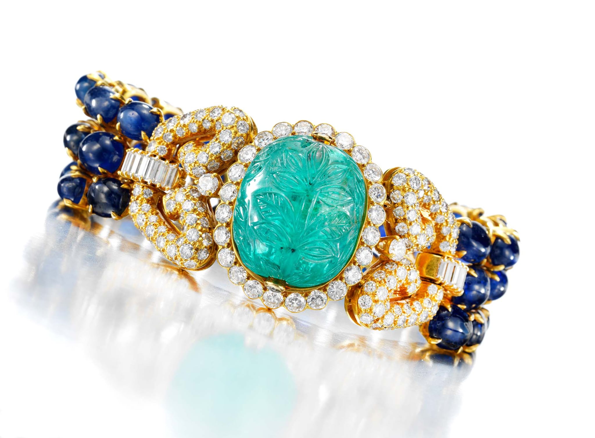 Van Cleef & Arpels Carved Emerald, Sapphire and Diamond Bracelet, circa 1975 © FD