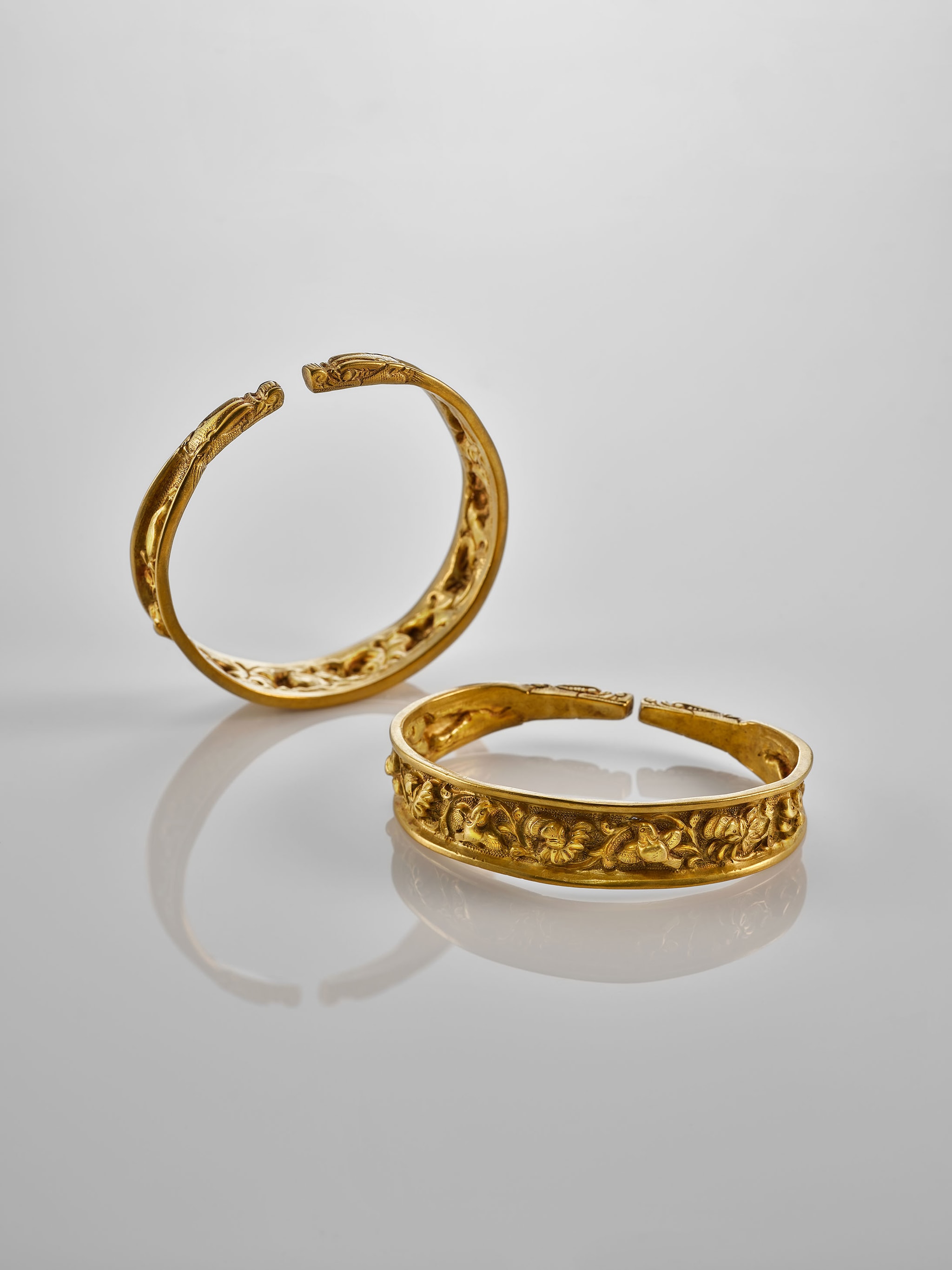 Pair of Bracelets with flower and bird designs, Liao Dynasty, 907-1125, Courtesy of the Mengdiexuan Collection. Photo Picspark Co