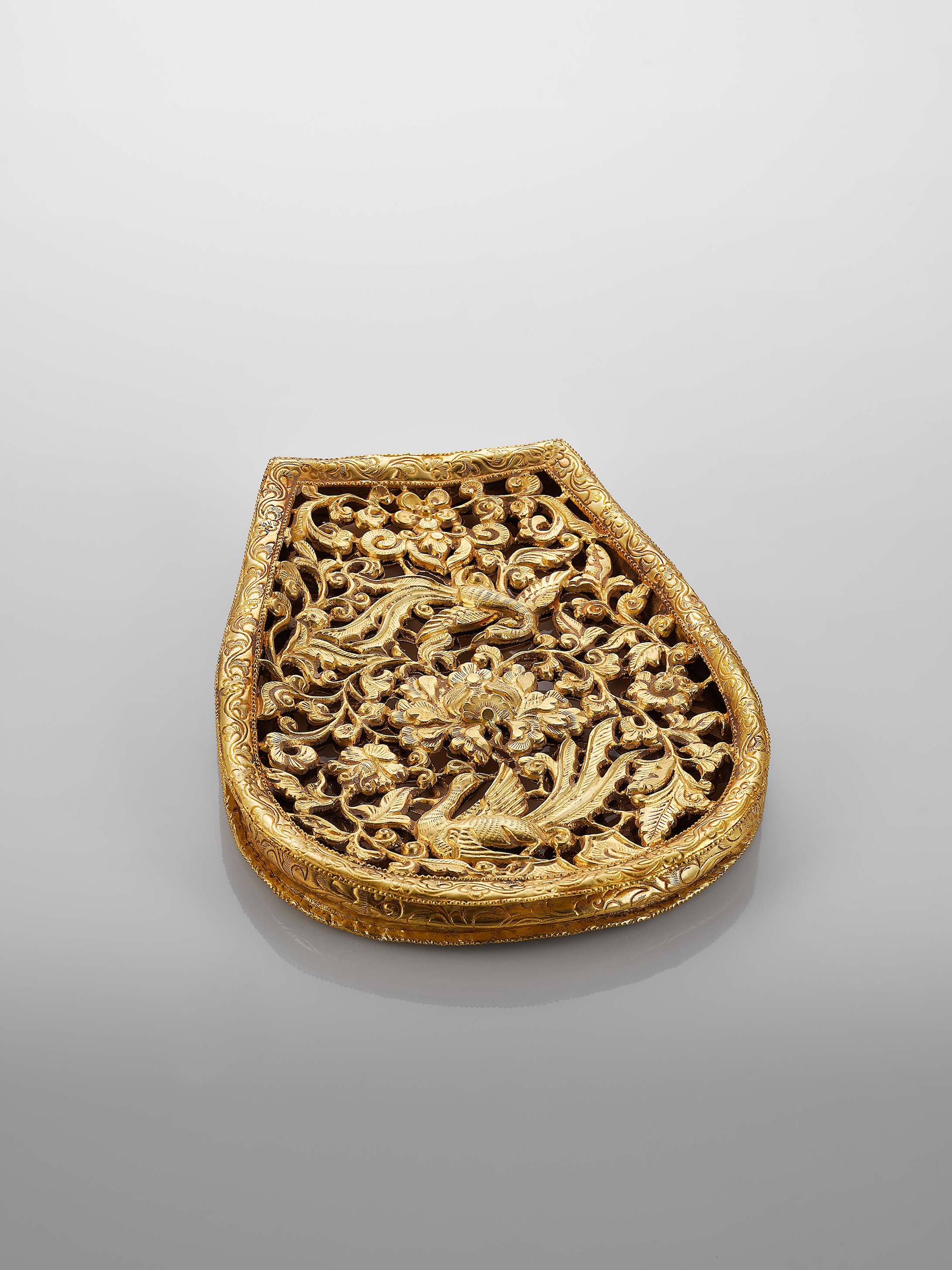 Pear-shaped gold cape weights with bird-and-peony designs, Song to Ming Dynasty, 960-1644, Mengdiexuan Collection. Photo Picspark Co