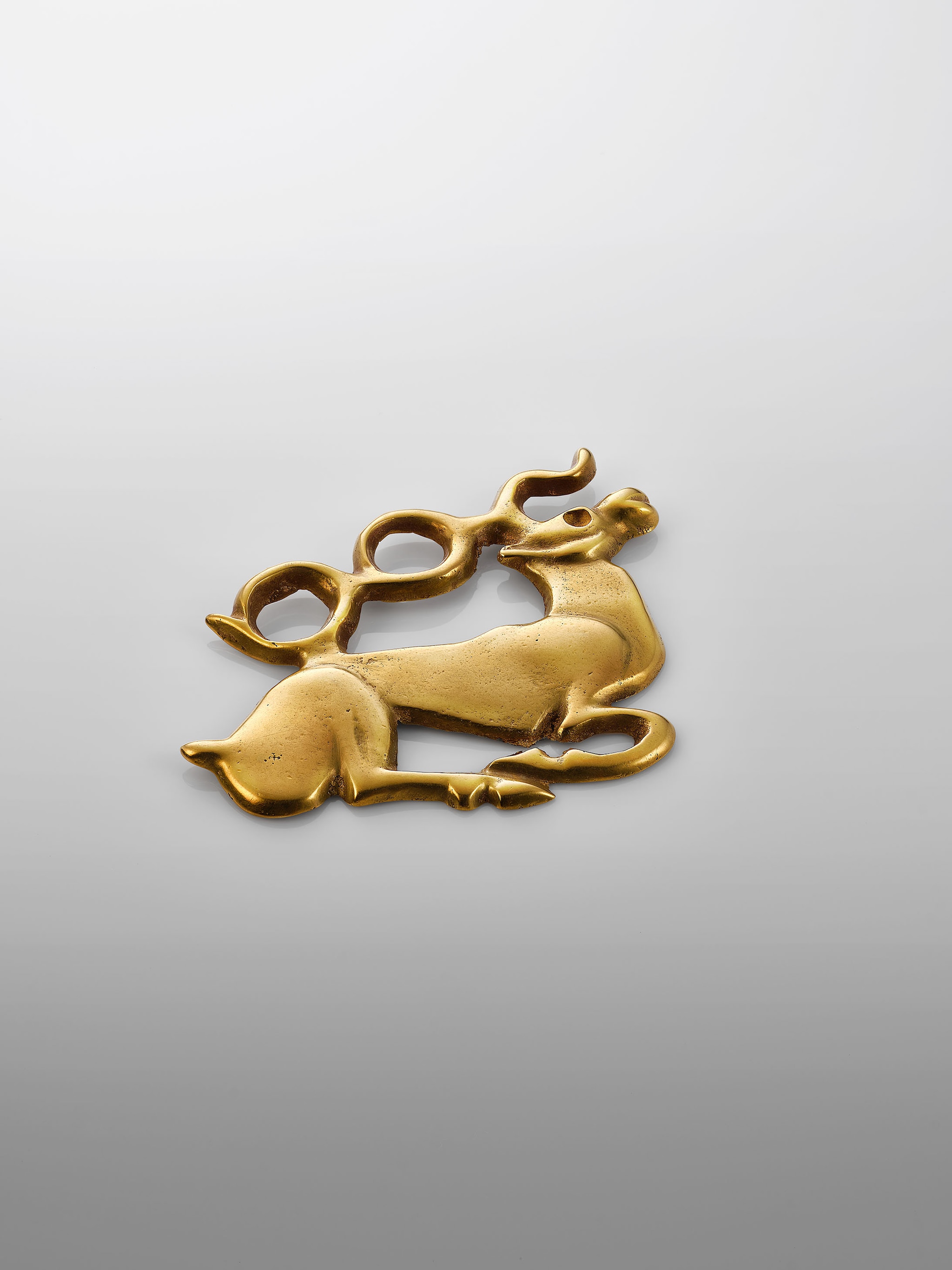 Recumbent stag ornament, 6th to 5th century BCE, Courtesy of the Mengdiexuan Collection. Photo Picspark Co