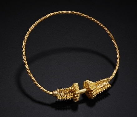 One of two replicas of the Montans torc in 24 karat gold. 