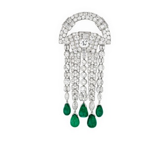 Brooch in platinum, emeralds (pear) and diamonds