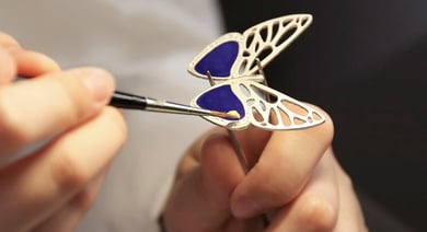 A butterfely is being enameled