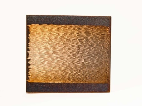 Steel engraved by hand; golden light revealed